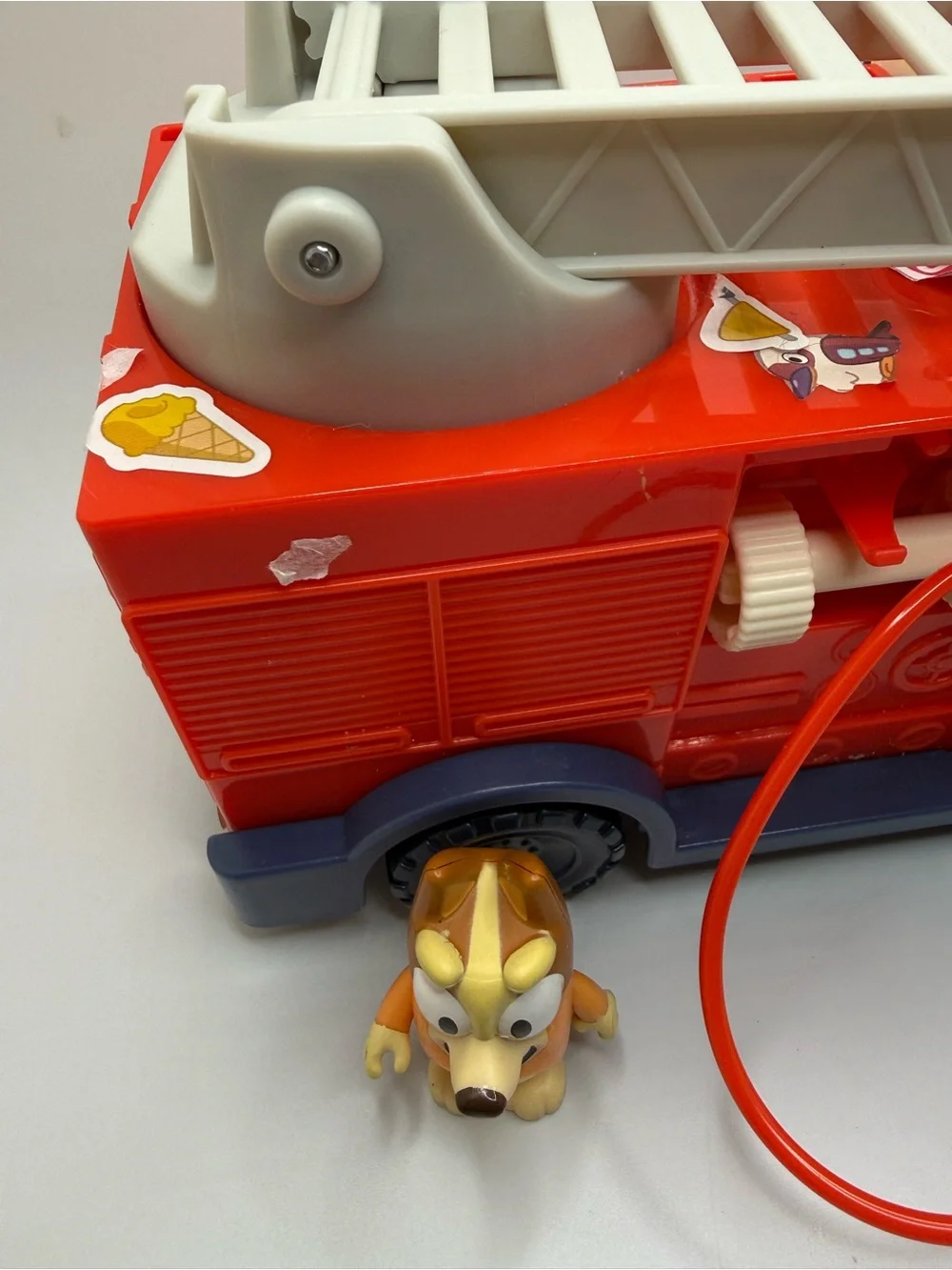 Disney Bluey fire truck playset toy with bingo bluey figure